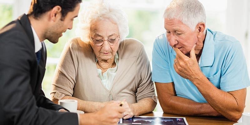 Financial advisor explaining options to a senior