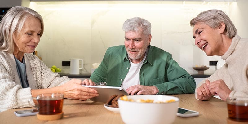 Senior couple with a caregiver at home