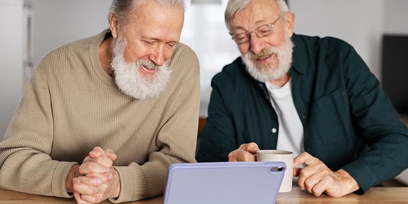 Elderly man looking at financial documents